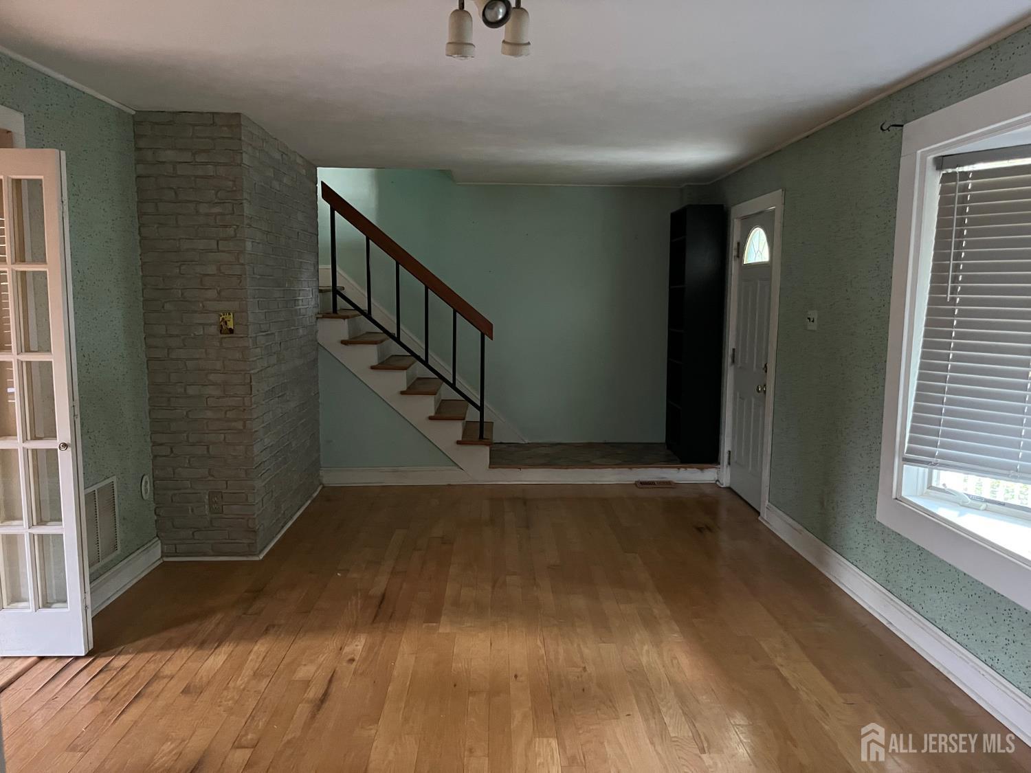 45 Old New Road Monmouth Junction, NJ 08852 - Photo 7 of 22 a view of entryway with wooden floor and stairs