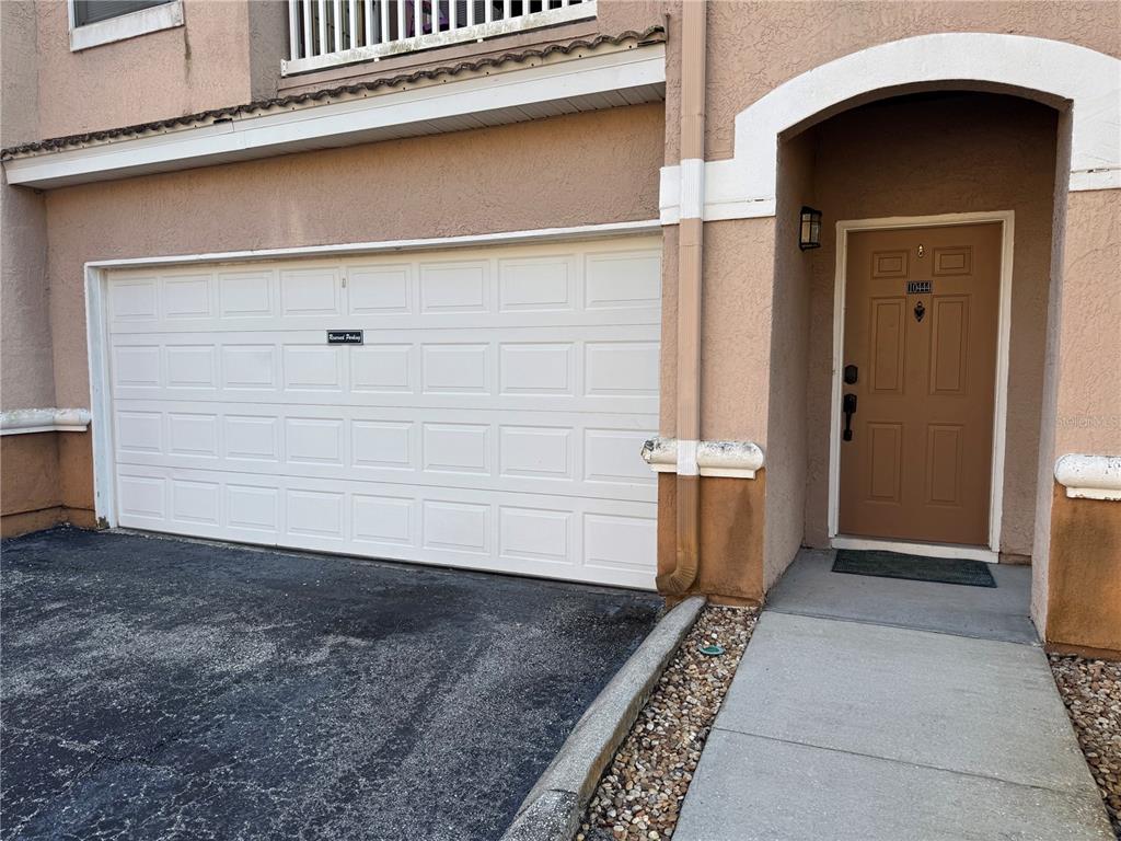 a view of a door and a garage