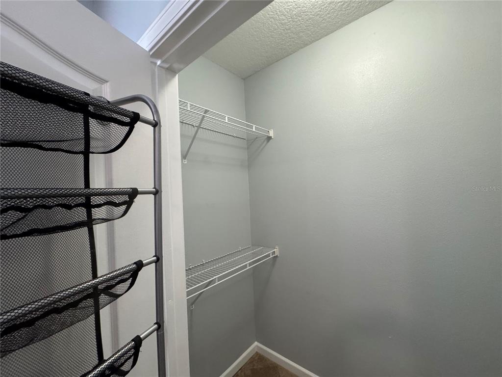 10444 Villa View Circle Tampa, FL 33647 - Photo 13 of 29 a view of a room with rack on the wall