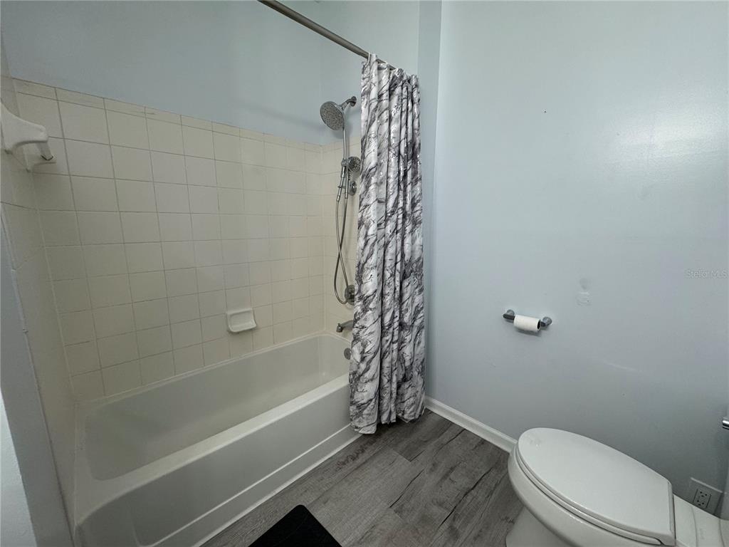 10444 Villa View Circle Tampa, FL 33647 - Photo 16 of 29 a bathroom with a toilet and shower