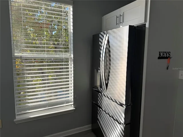 a view of a refrigerator and window