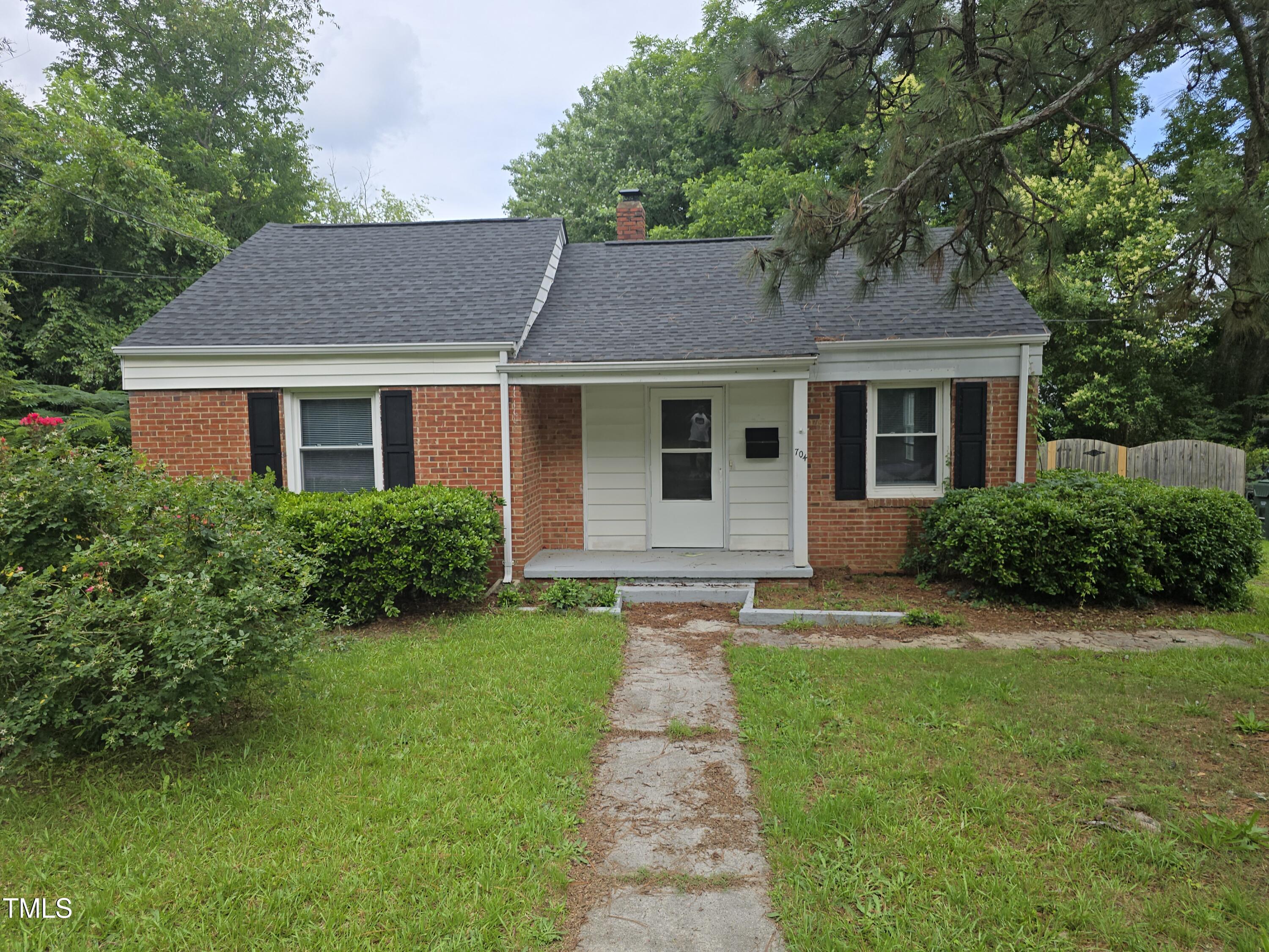 704 North King Charles Road Raleigh, NC 27610 - Photo 1 of 7 a front view of a house with a yard