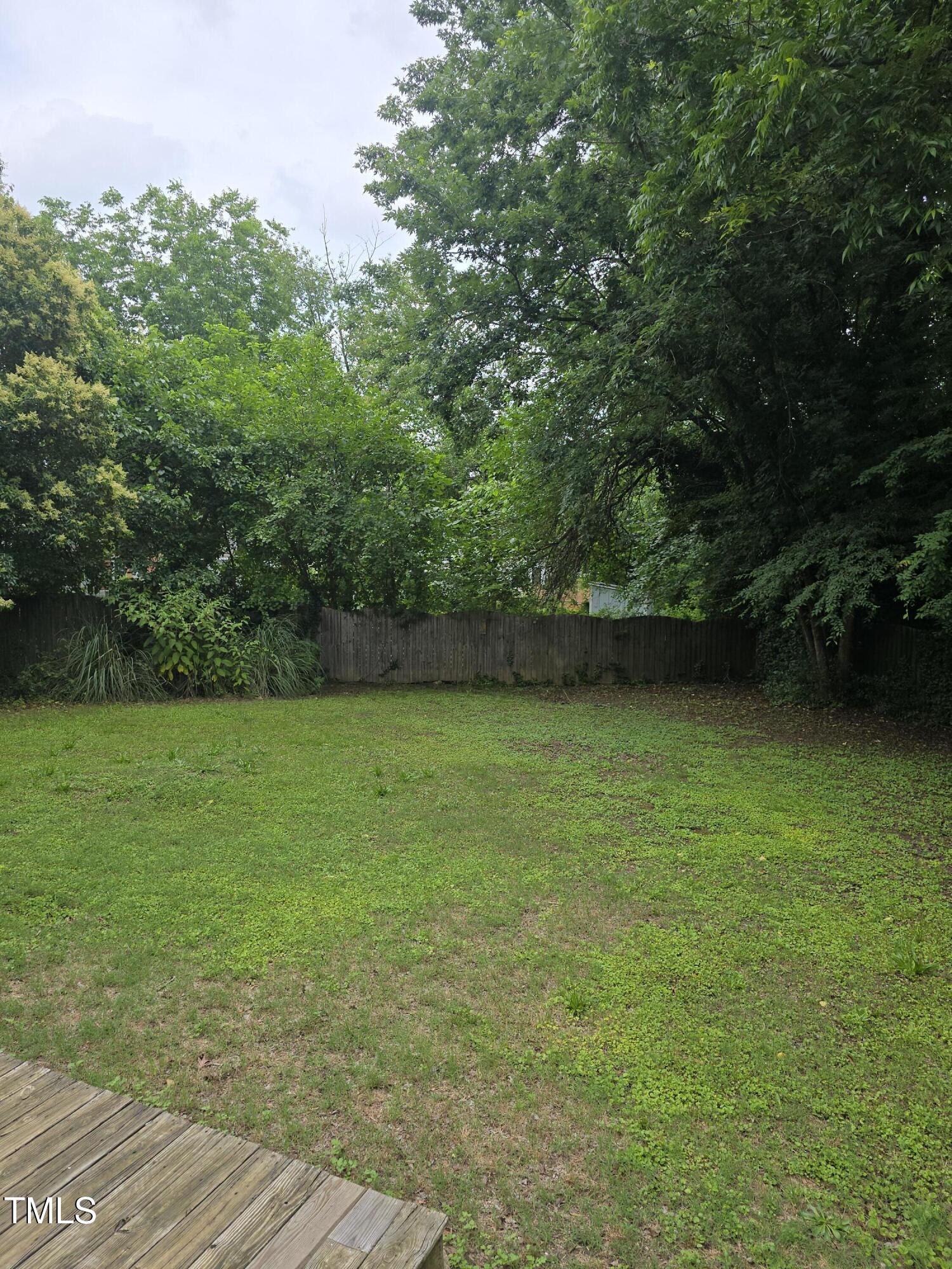 704 North King Charles Road Raleigh, NC 27610 - Photo 6 of 7 a view of yard with swimming pool and green space