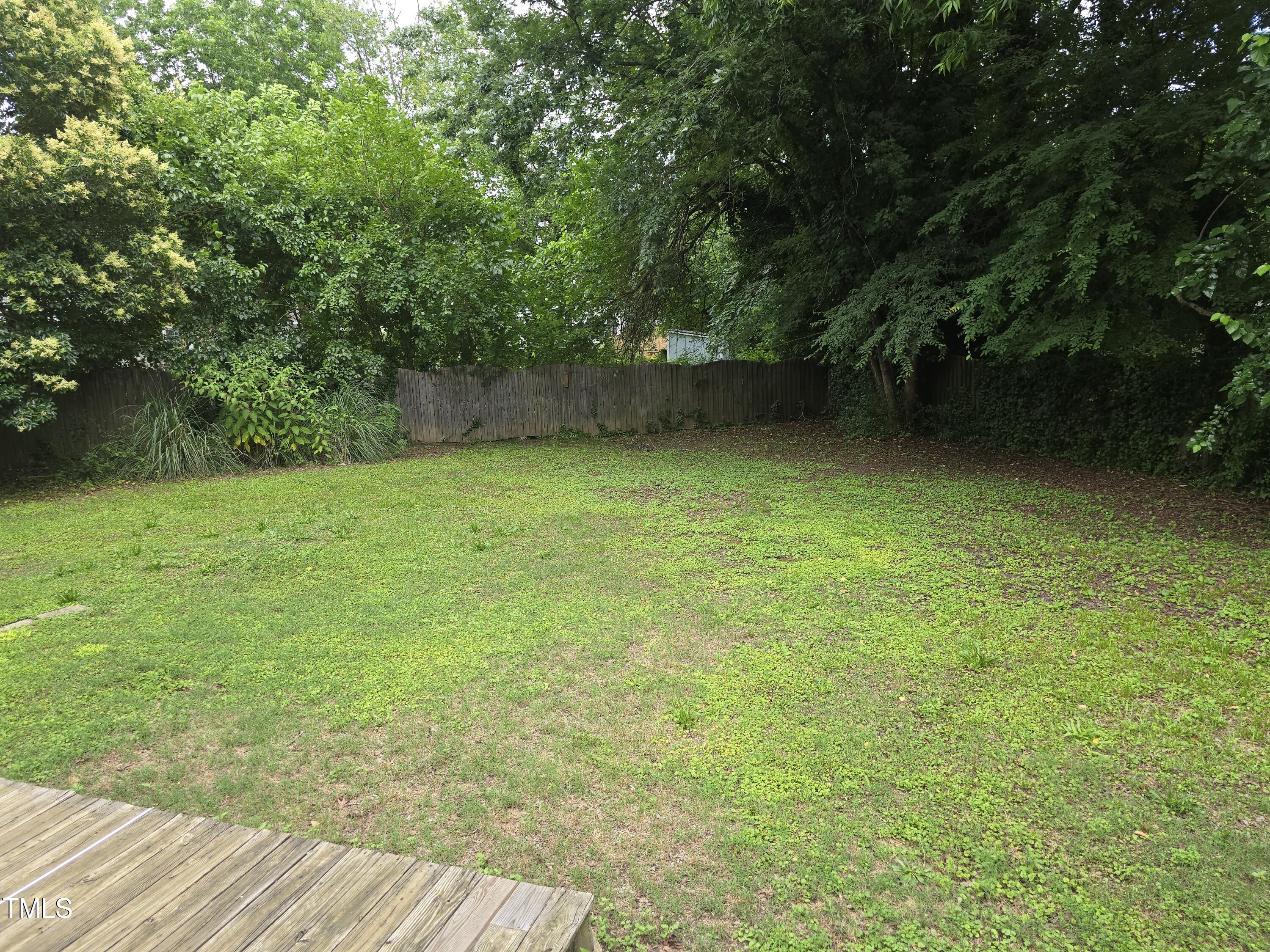 704 North King Charles Road Raleigh, NC 27610 - Photo 7 of 7 a view of a green yard