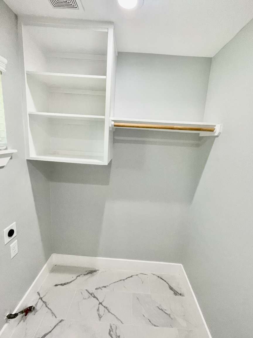 12122 Chimney Rock Road Houston, TX 77035 - Photo 12 of 33 a view of a room with shelf