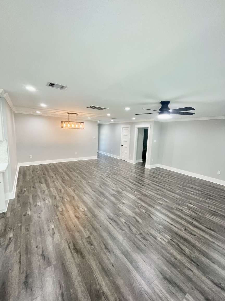 12122 Chimney Rock Road Houston, TX 77035 - Photo 13 of 33 a view of empty room with wooden floor