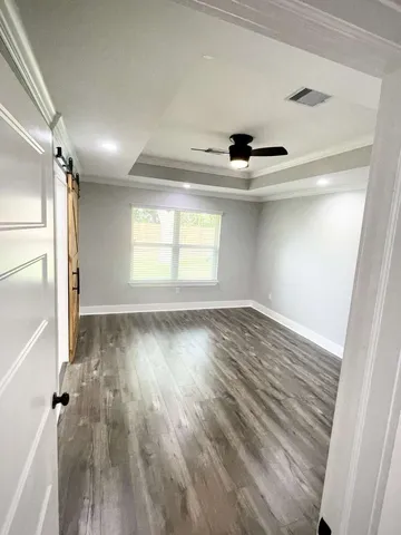 a bathroom with a shower and a sink