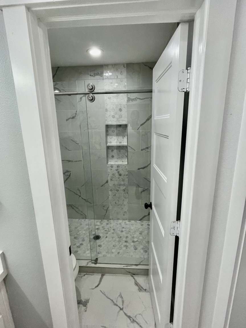 12122 Chimney Rock Road Houston, TX 77035 - Photo 24 of 33 a bathroom with a shower and a sink