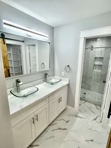 a bathroom with a toilet and shower