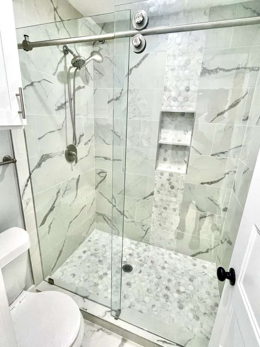 12122 Chimney Rock Road Houston, TX 77035 - Photo 26 of 33 a bathroom with a toilet and shower