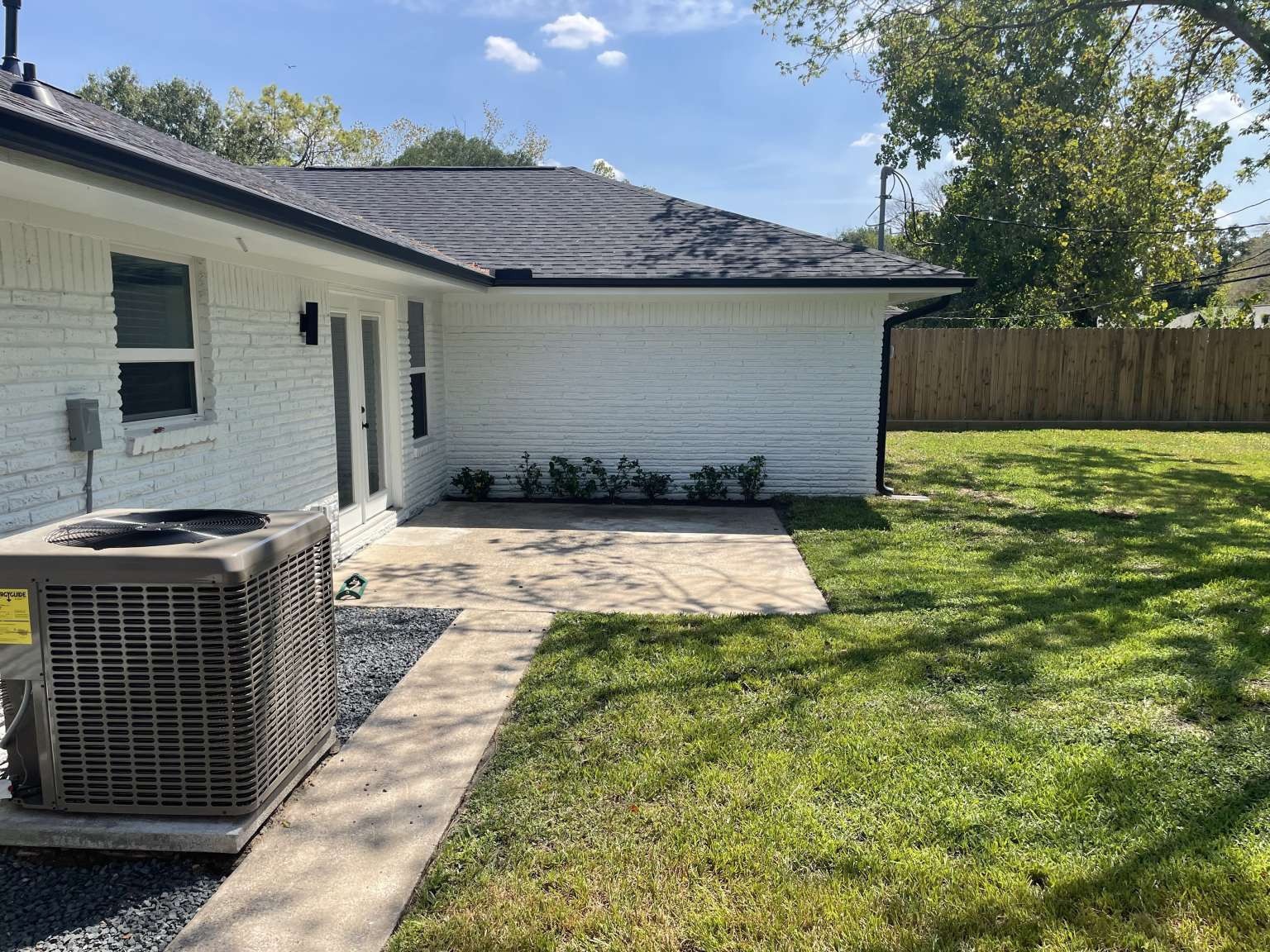 12122 Chimney Rock Road Houston, TX 77035 - Photo 32 of 33 a view of a backyard with table and chairs and wooden fence