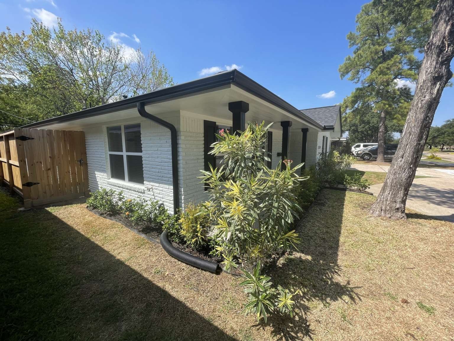 12122 Chimney Rock Road Houston, TX 77035 - Photo 6 of 33 a front view of house with yard and trees around