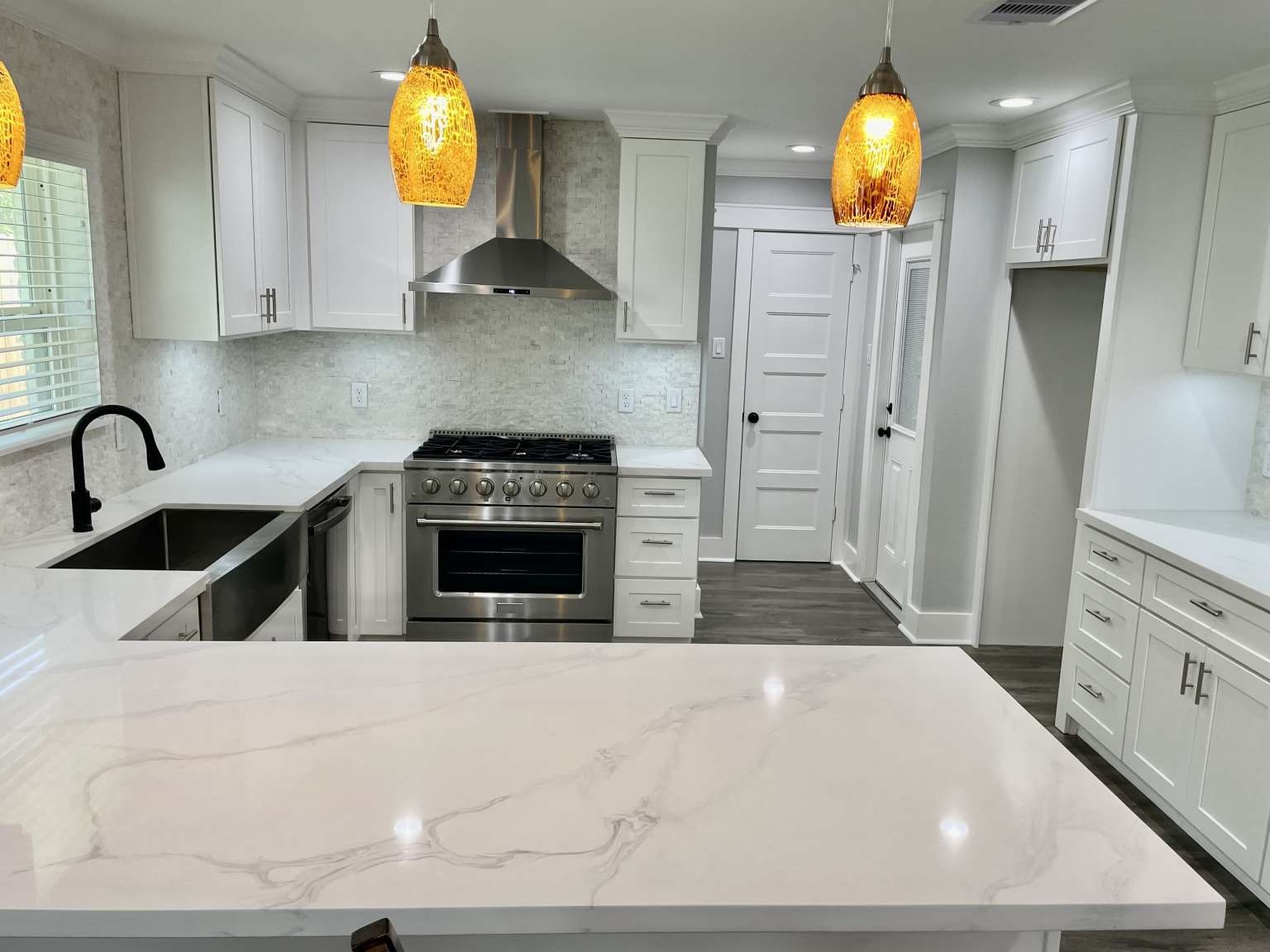 12122 Chimney Rock Road Houston, TX 77035 - Photo 10 of 33 a kitchen with stainless steel appliances a stove a sink and a refrigerator