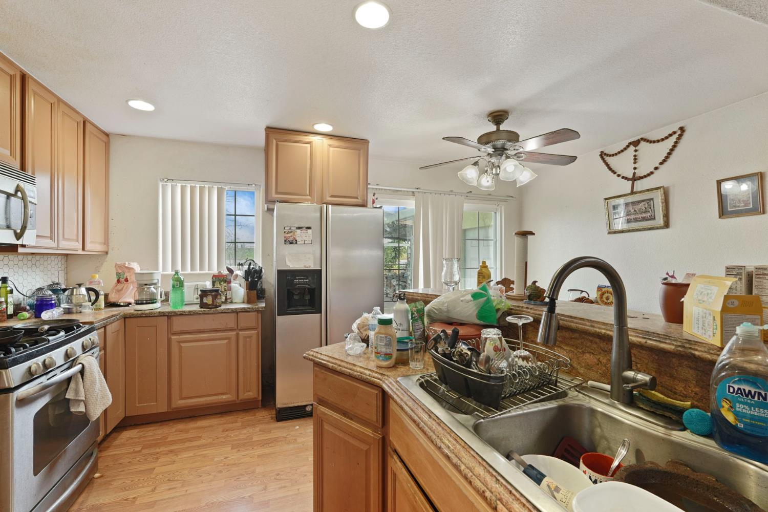 1234 Perry Avenue Stockton, CA 95203 - Photo 15 of 30 a kitchen with a sink appliances and cabinets