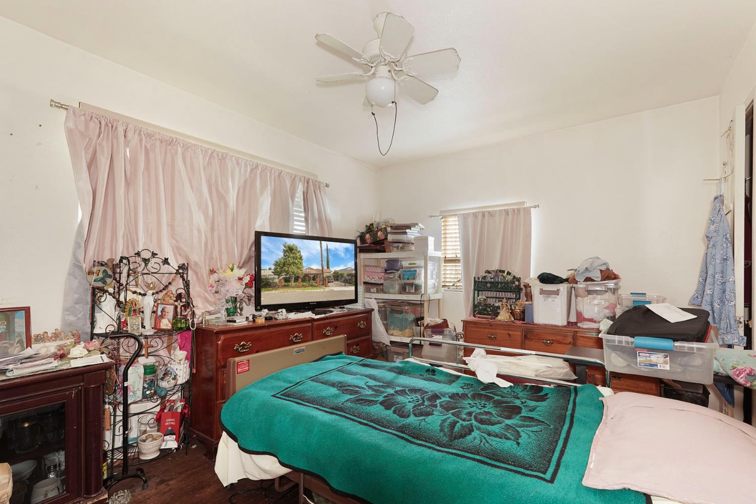1234 Perry Avenue Stockton, CA 95203 - Photo 16 of 30 a living room with furniture and a flat screen tv