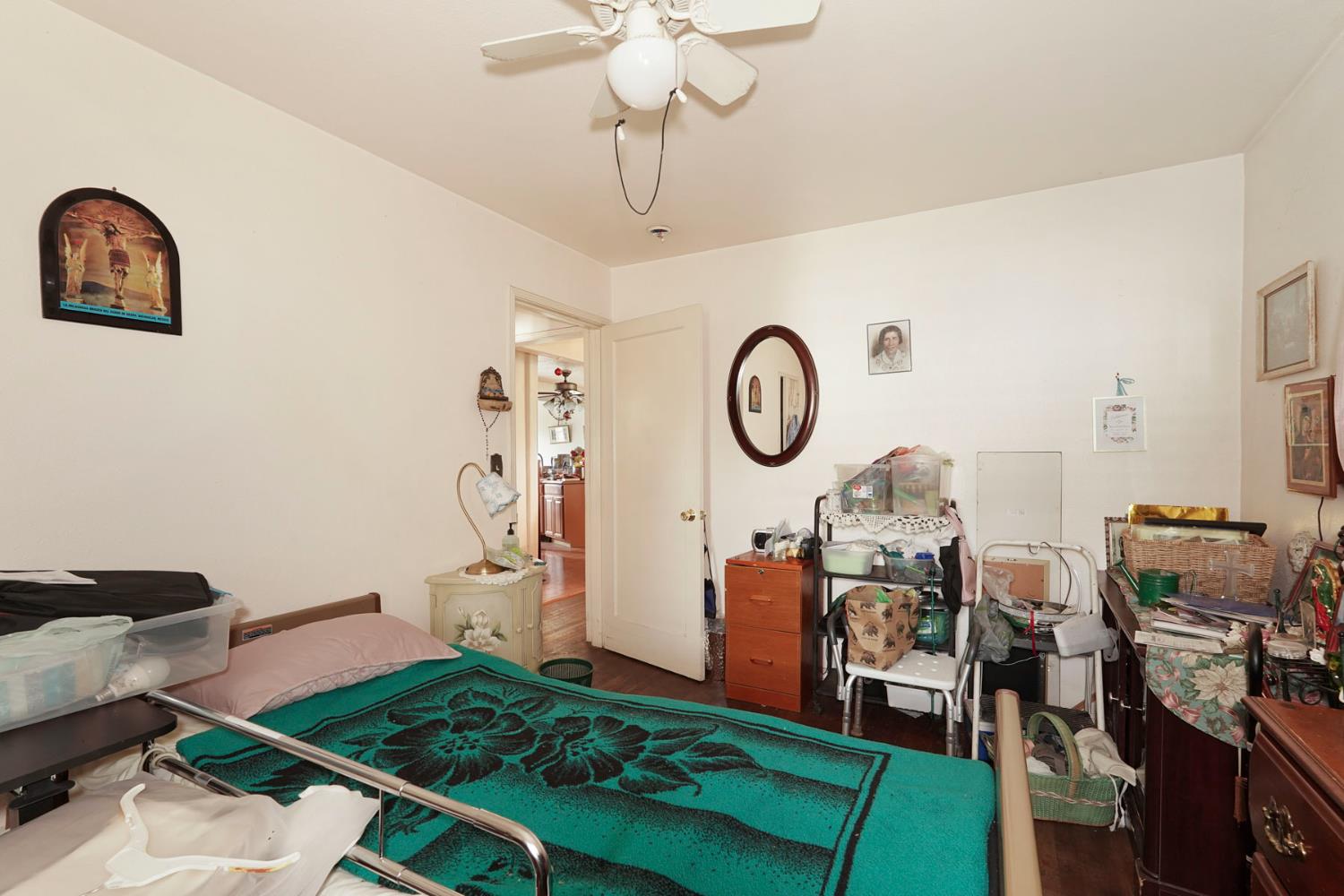 1234 Perry Avenue Stockton, CA 95203 - Photo 17 of 30 a living room with lots of furniture and a clock