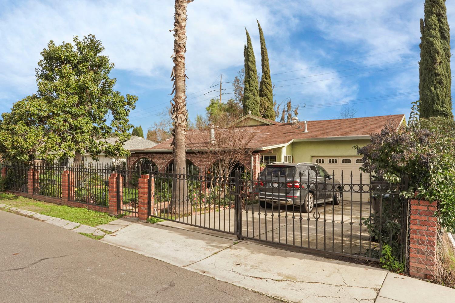 1234 Perry Avenue Stockton, CA 95203 - Photo 2 of 30 a view of a building with a street