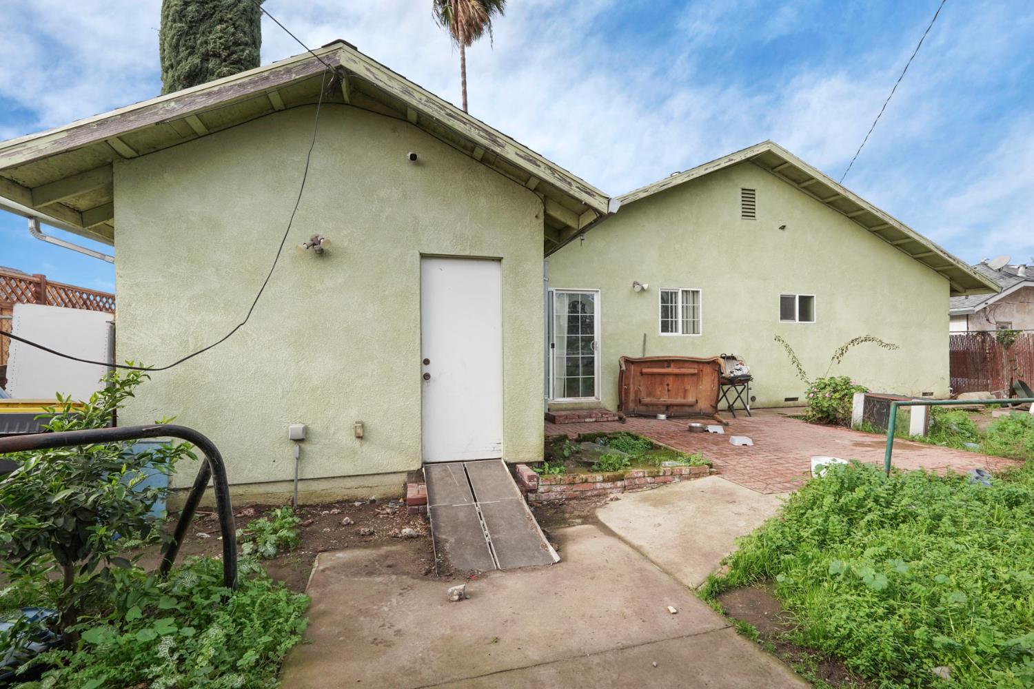 1234 Perry Avenue Stockton, CA 95203 - Photo 25 of 30 a front view of a house with garden