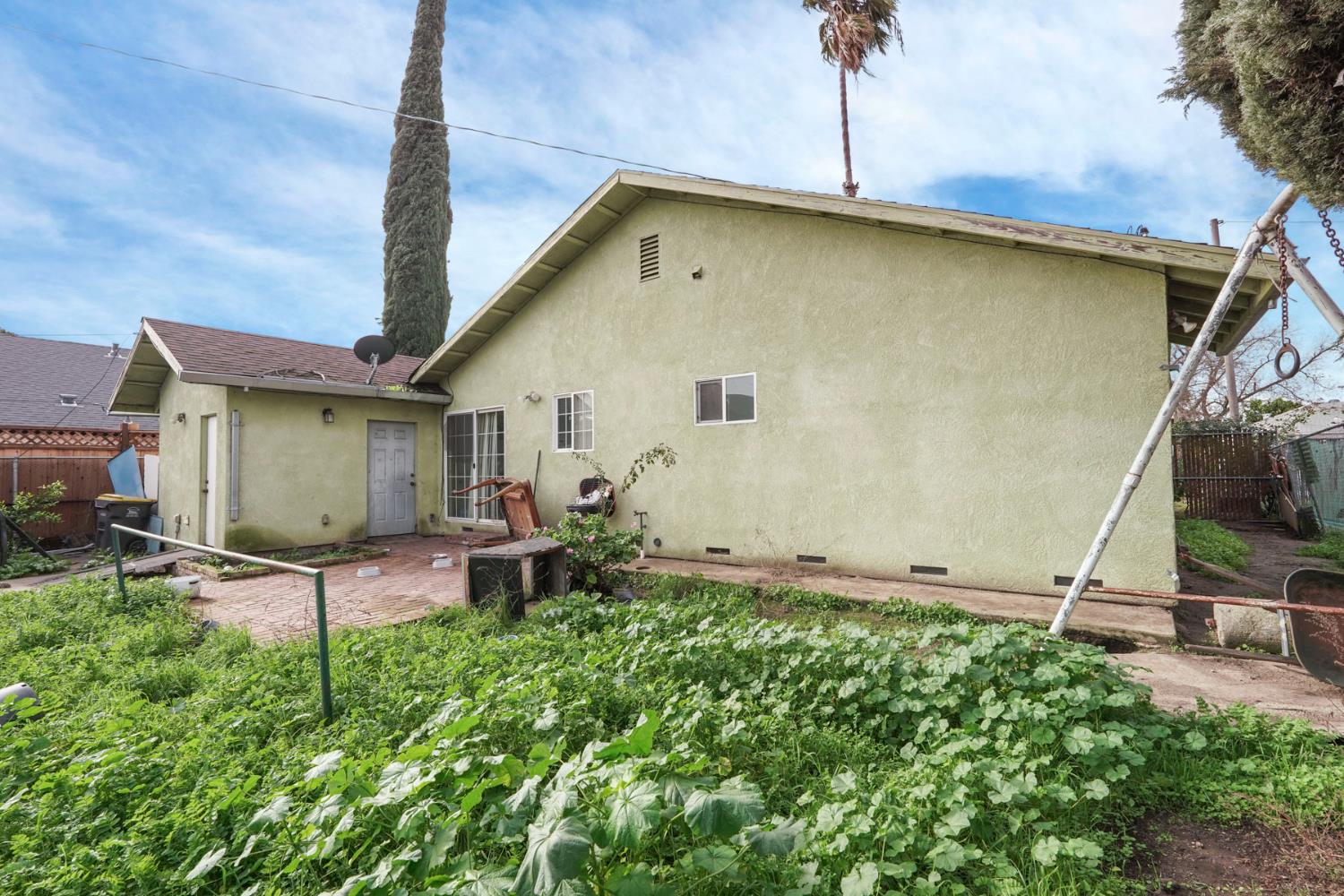 1234 Perry Avenue Stockton, CA 95203 - Photo 26 of 30 a view of a backyard with plants