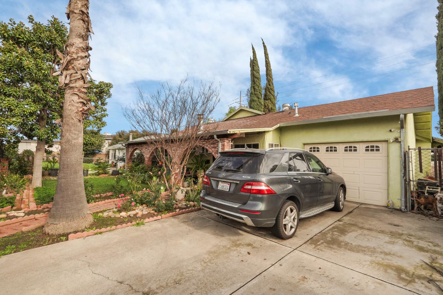1234 Perry Avenue Stockton, CA 95203 - Photo 4 of 30 a car parked in front of a building
