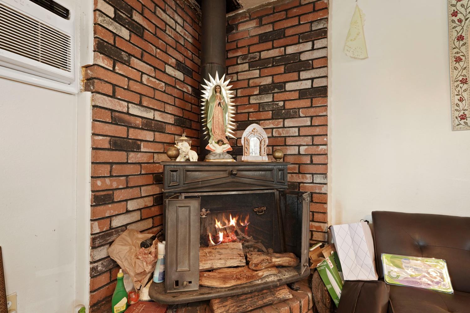 1234 Perry Avenue Stockton, CA 95203 - Photo 10 of 30 a living room with a fireplace