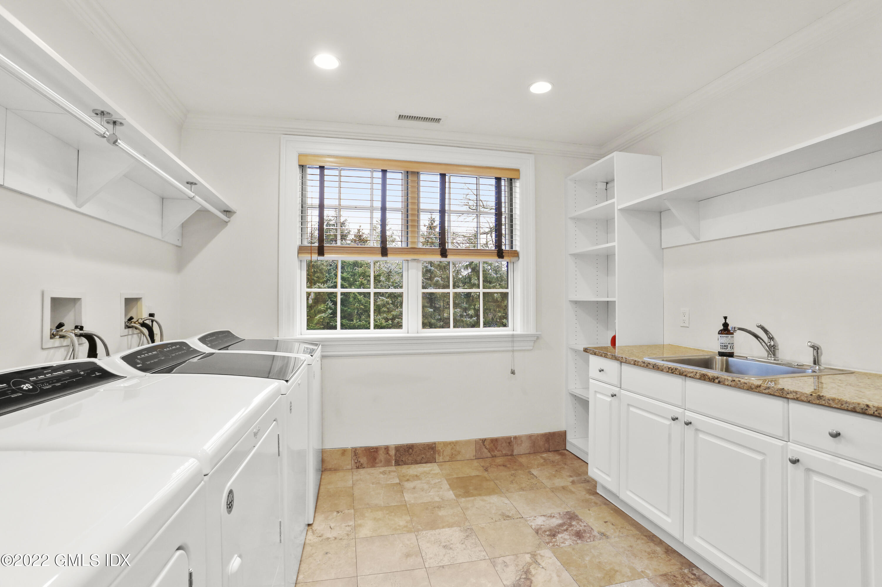 142 Cat Rock Road Cos Cob, CT 06807 - Photo 17 of 27 a kitchen with a sink and a stove top oven