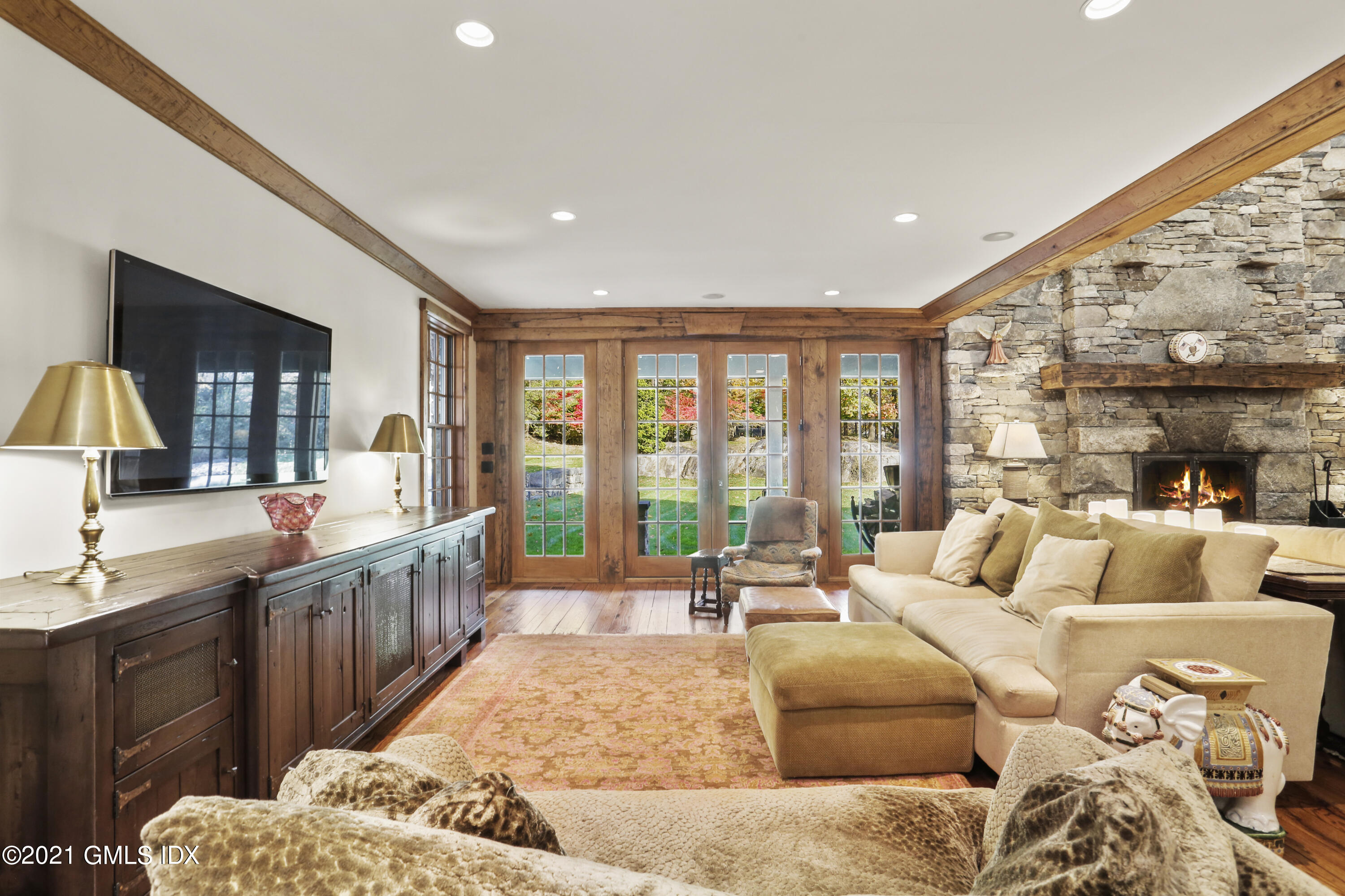 142 Cat Rock Road Cos Cob, CT 06807 - Photo 6 of 27 a bedroom with furniture and a large window