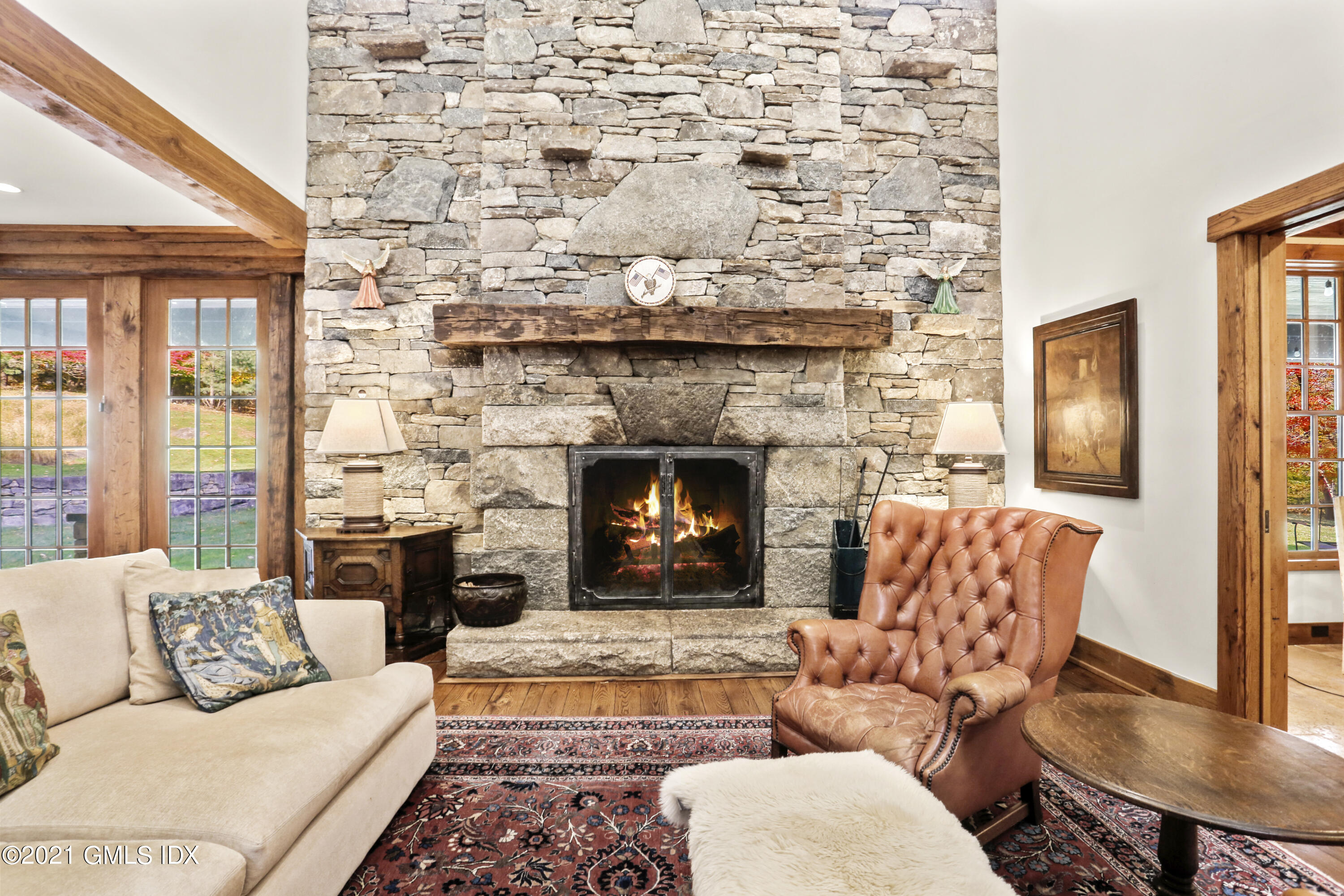 142 Cat Rock Road Cos Cob, CT 06807 - Photo 8 of 27 a living room with furniture and a fireplace