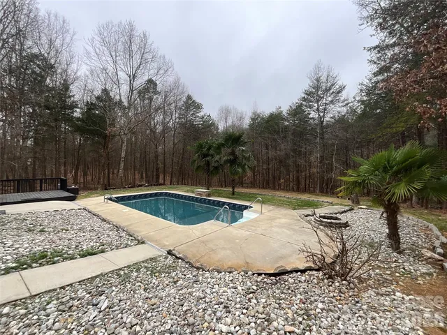 a view of a backyard with a bench