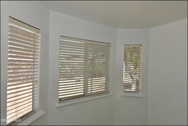 a view of a room that has a window in it