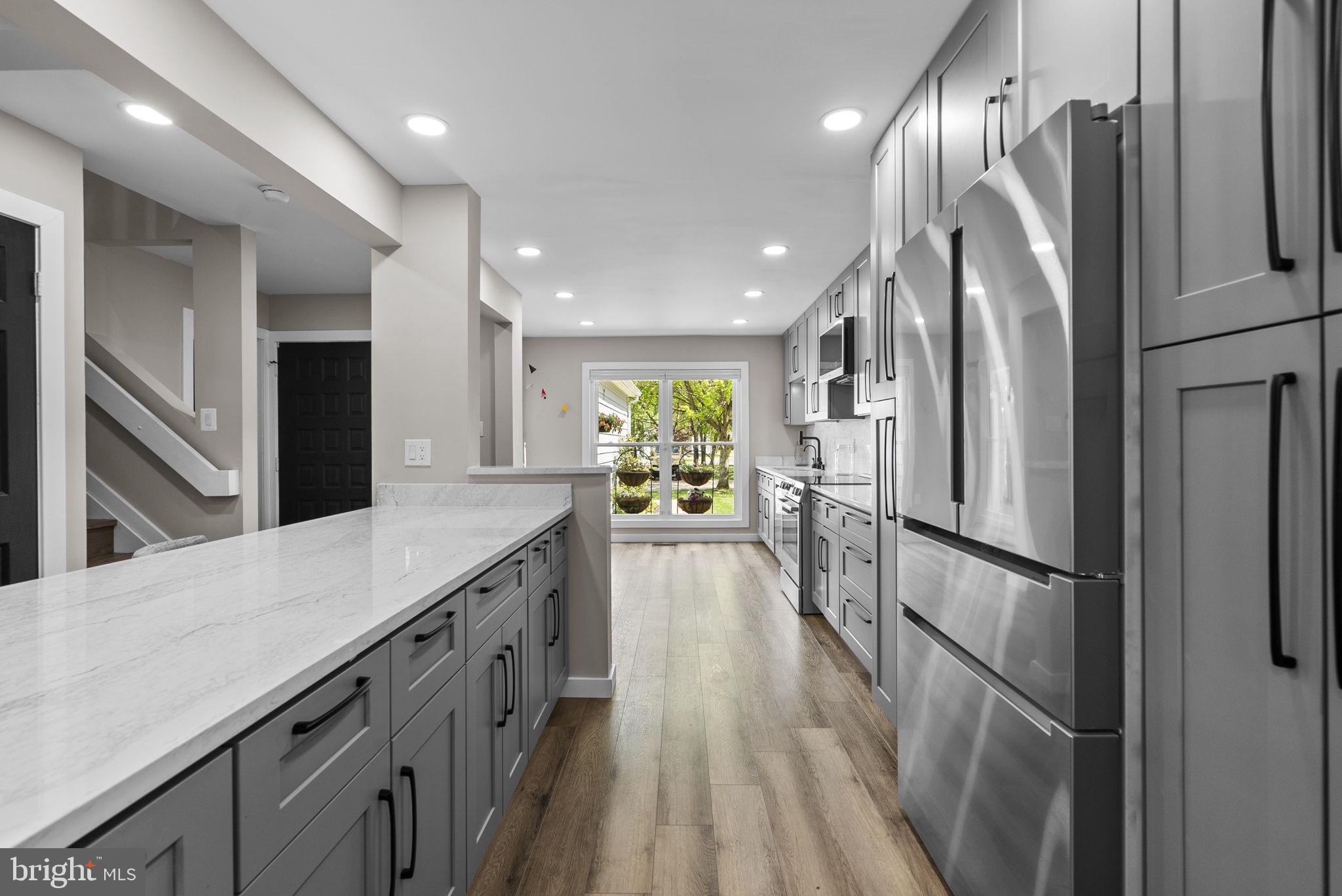 2924 Winters Chase Way Annapolis, MD 21401 - Photo 21 of 67 a kitchen with stainless steel appliances a refrigerator and a sink