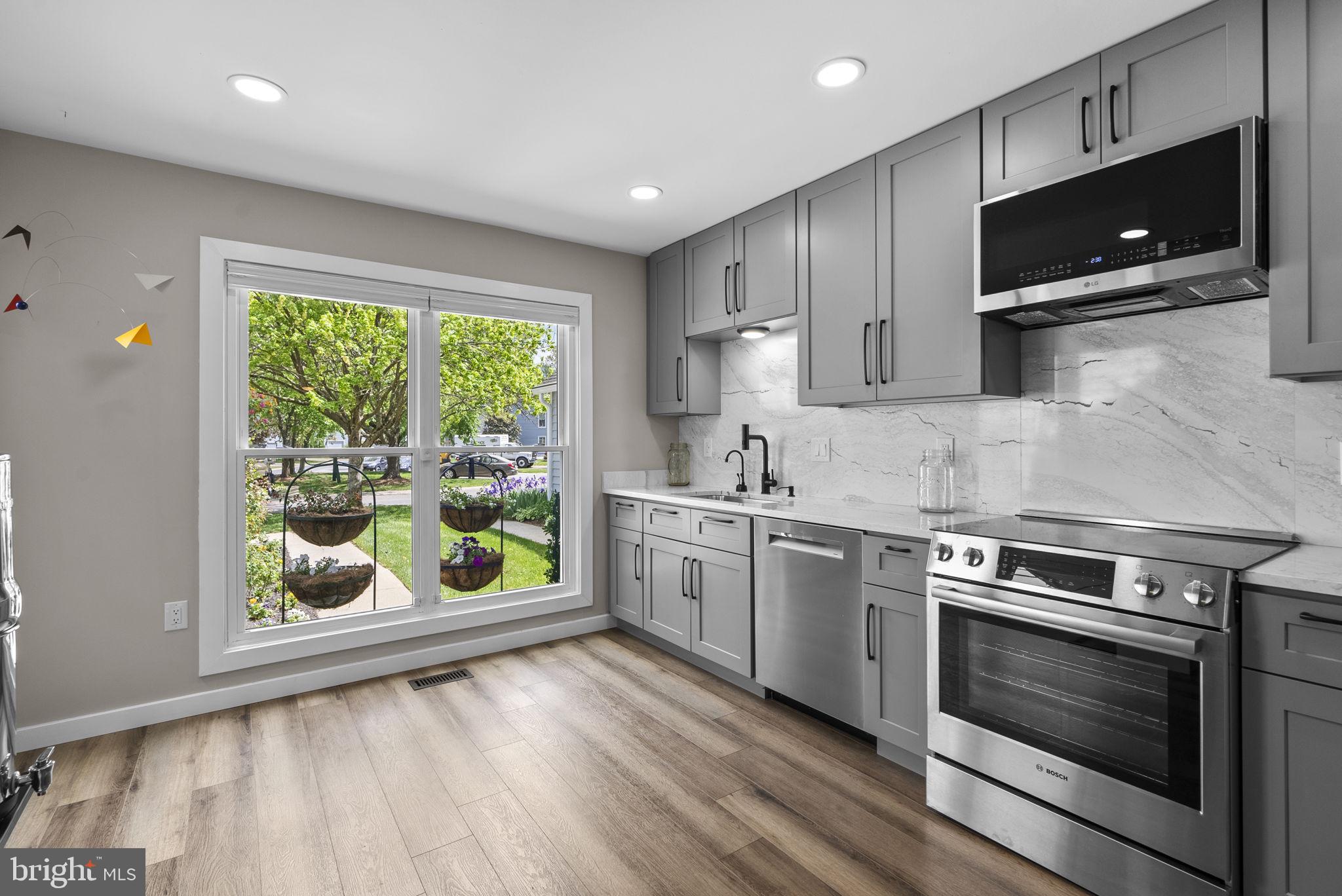 2924 Winters Chase Way Annapolis, MD 21401 - Photo 22 of 67 a kitchen with a stove a sink and a microwave