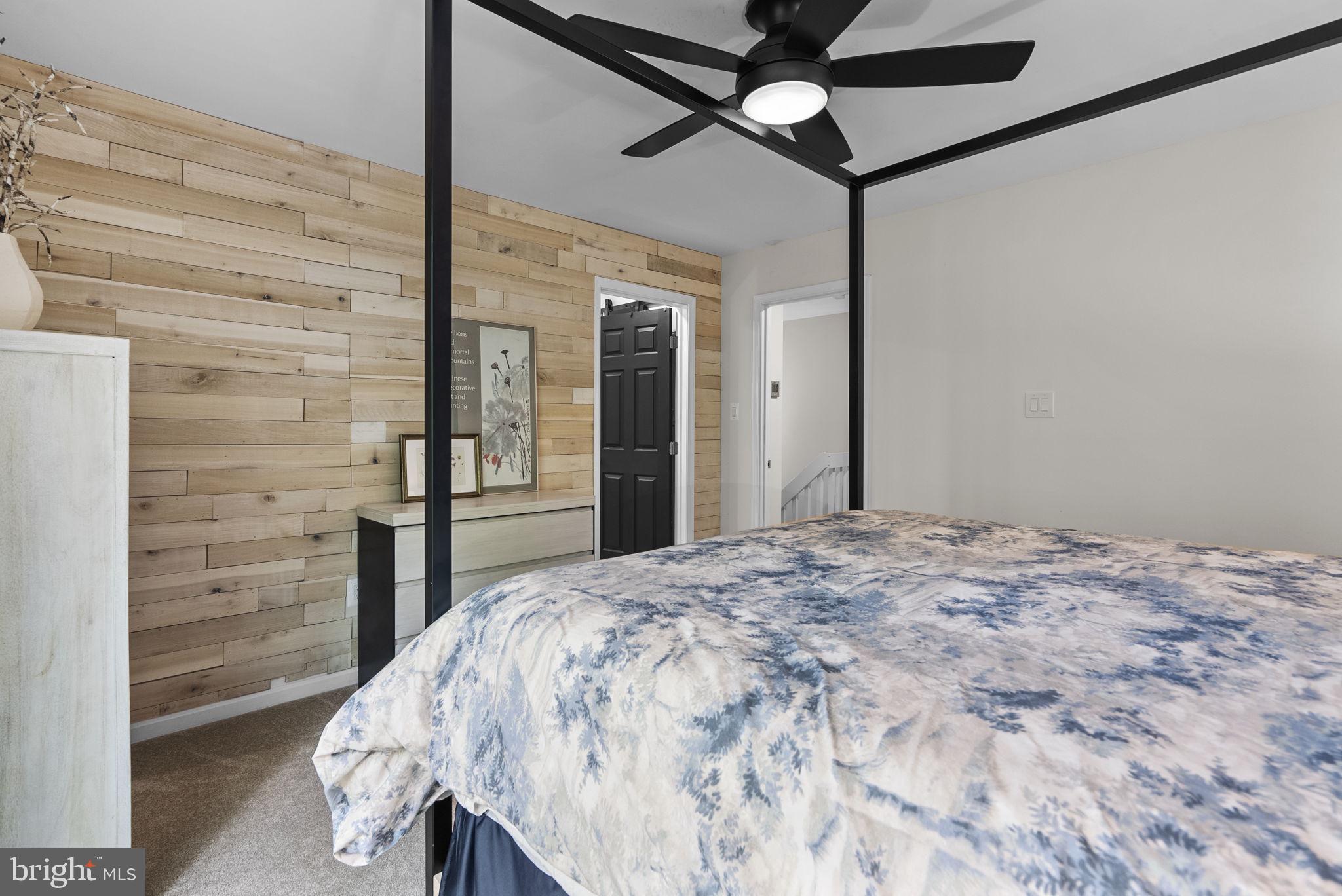 2924 Winters Chase Way Annapolis, MD 21401 - Photo 38 of 67 a bedroom with a bed and a chandelier