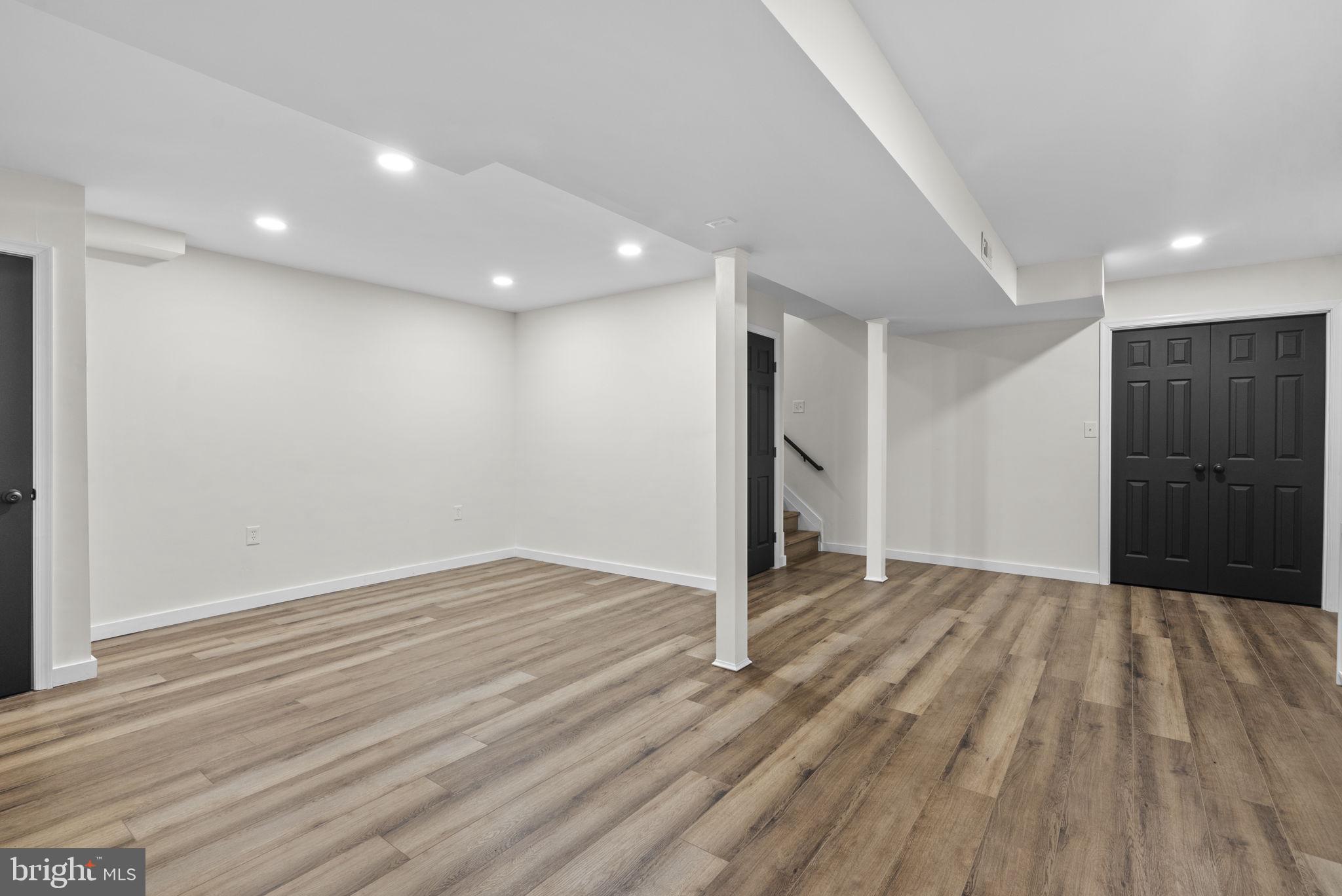 2924 Winters Chase Way Annapolis, MD 21401 - Photo 48 of 67 a view of an empty room with wooden floor