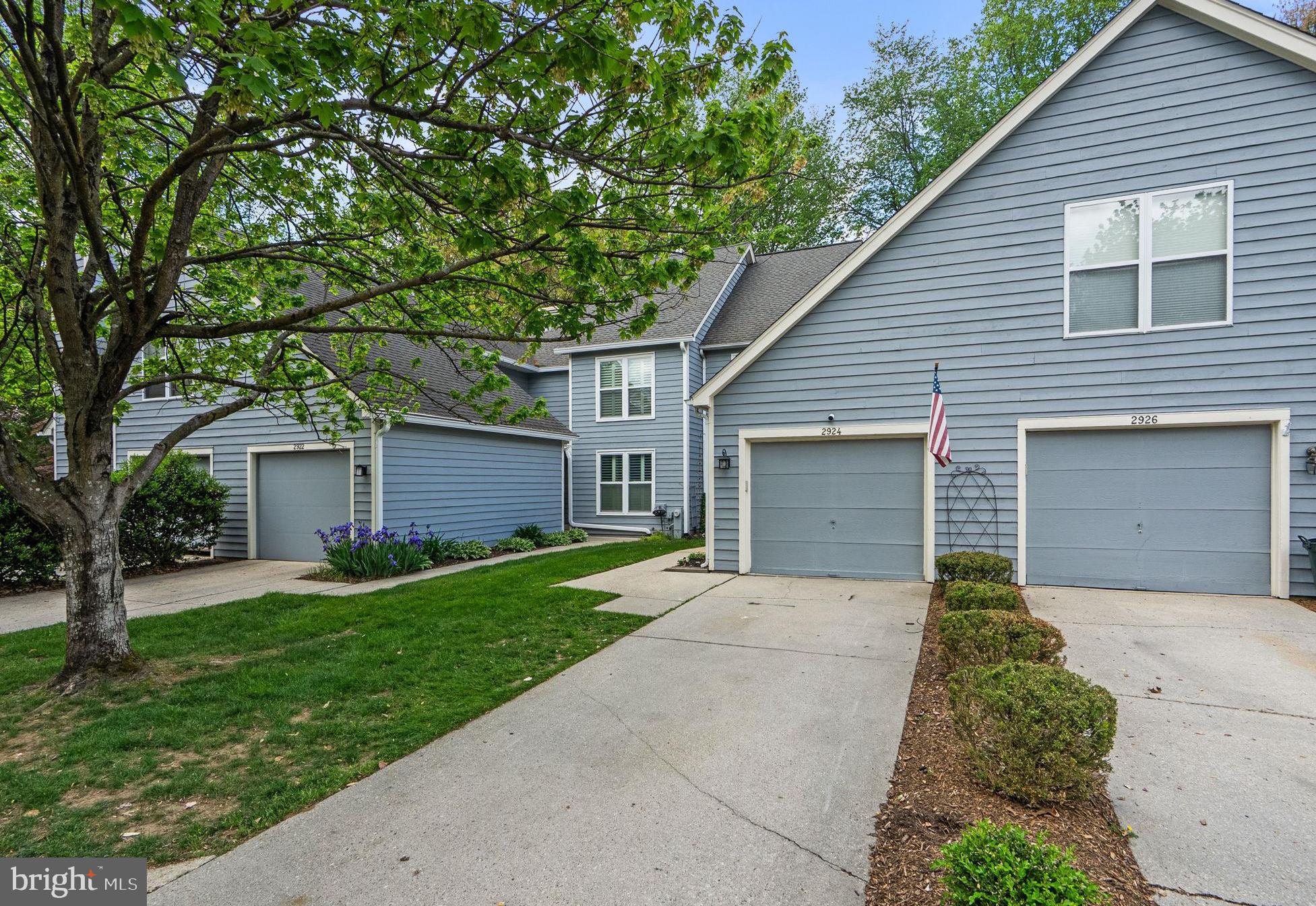 2924 Winters Chase Way Annapolis, MD 21401 - Photo 61 of 67 a front view of a house with a yard and garage