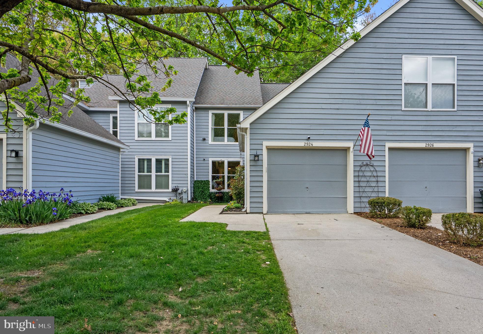 2924 Winters Chase Way Annapolis, MD 21401 - Photo 63 of 67 a front view of a house with a yard and garage