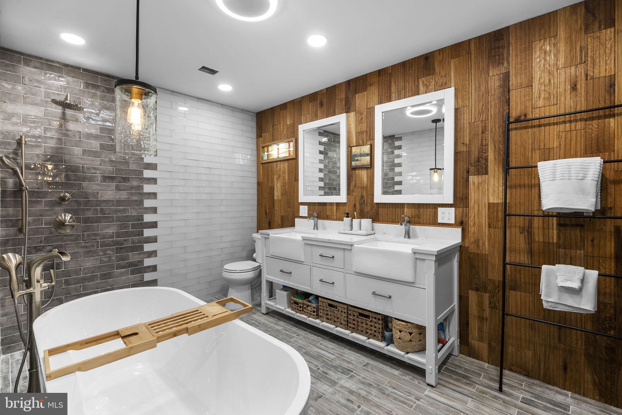 2924 Winters Chase Way Annapolis, MD 21401 - Photo 10 of 67 a bathroom with a double vanity sink a mirror and a shower