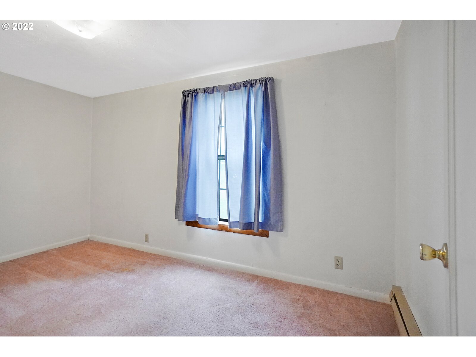11145 Whiteaker Road Dallas, OR 97338 - Photo 26 of 32 a view of an empty room with wooden floor and a window