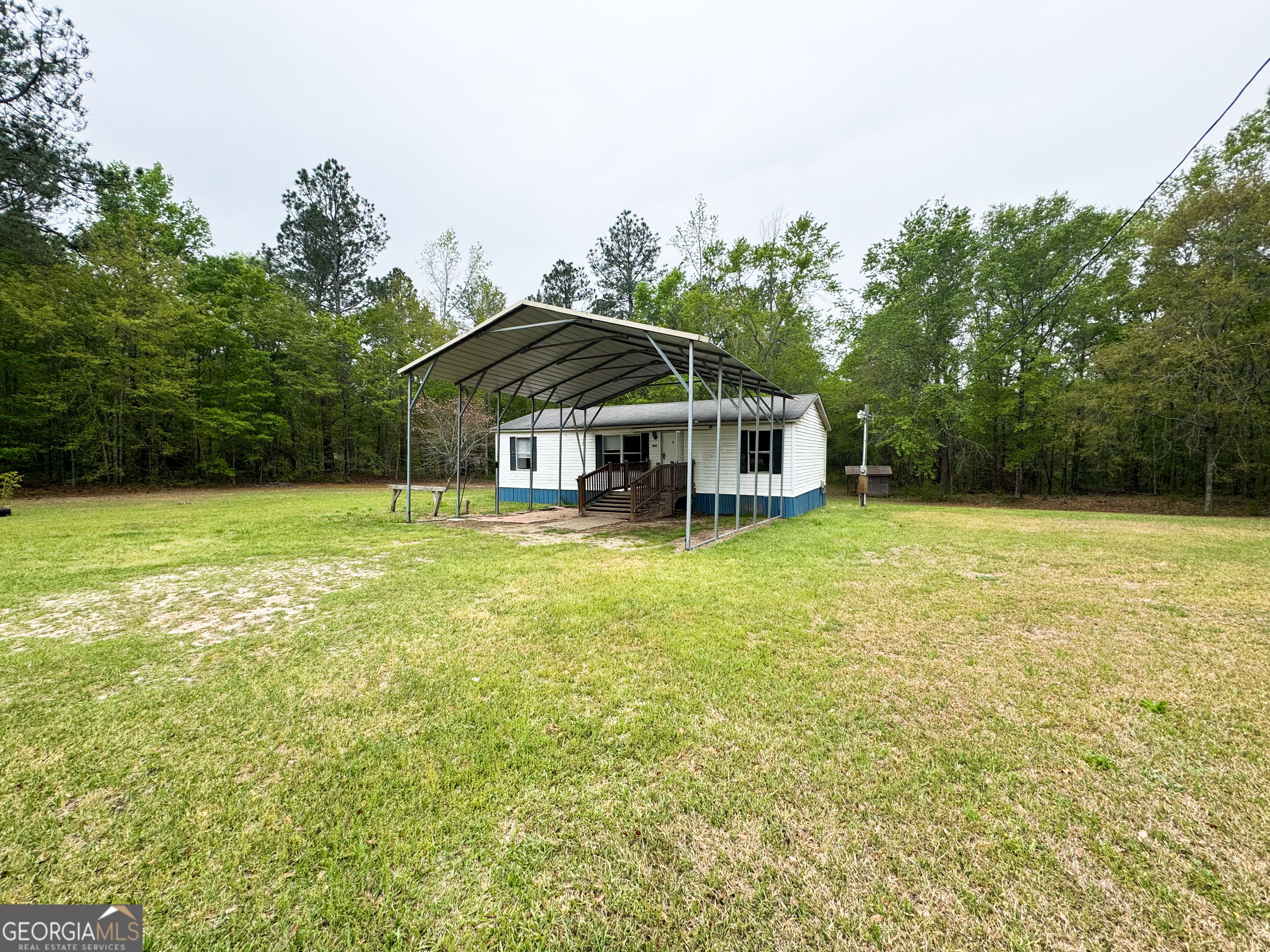 a view of a house with a big yard