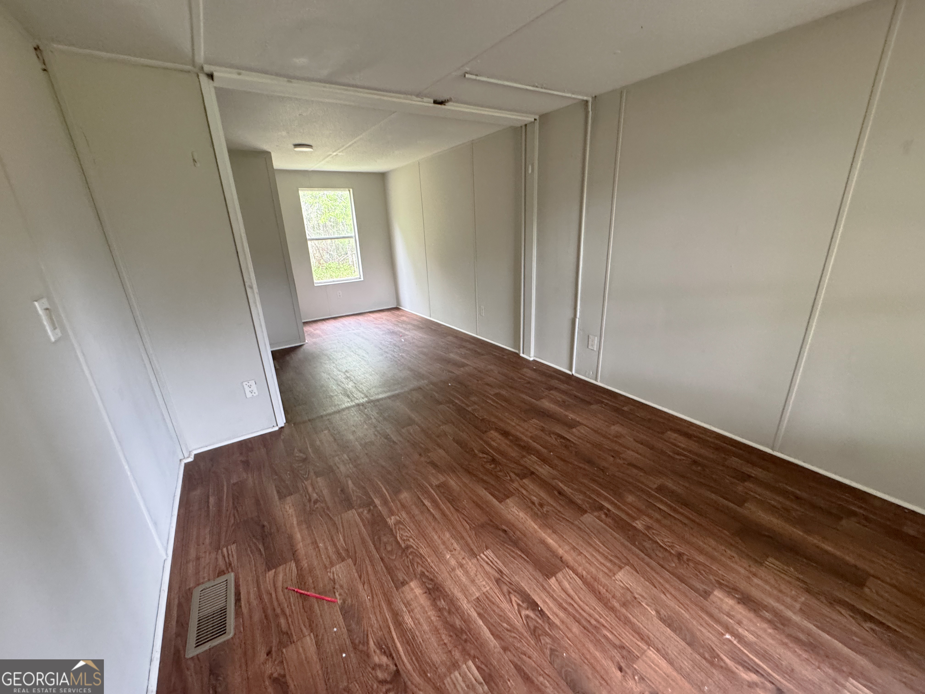 877 West Rushing Road Register, GA 30452 - Photo 14 of 18 a view of livingroom with hardwood floor and window