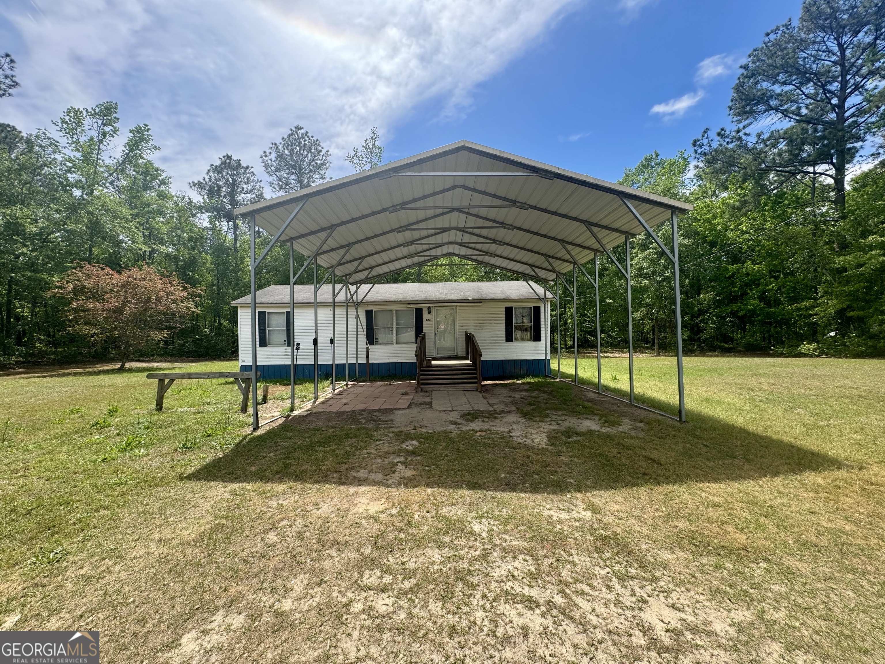 877 West Rushing Road Register, GA 30452 - Photo 2 of 18 a view of a house with backyard and sitting area