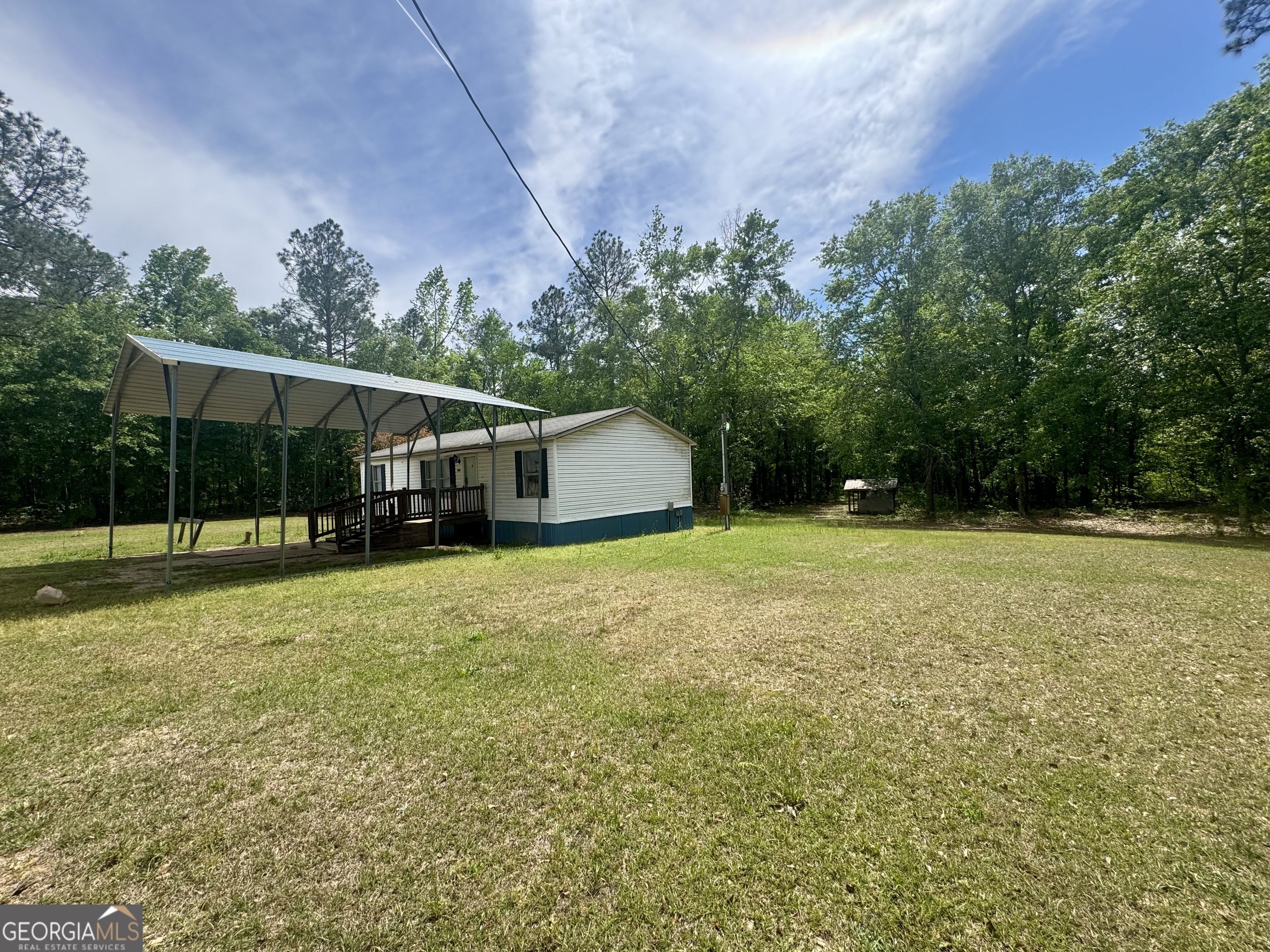 877 West Rushing Road Register, GA 30452 - Photo 3 of 18 a backyard of a house with lots of green space