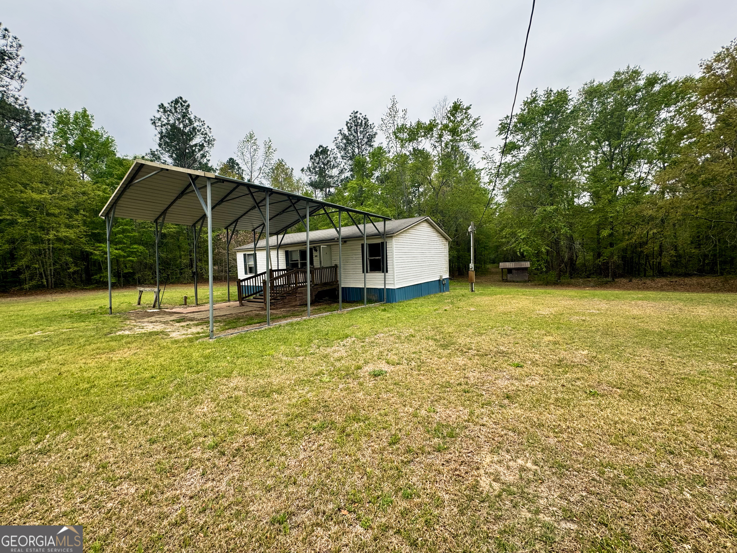 877 West Rushing Road Register, GA 30452 - Photo 5 of 18 a view of a house with a yard and sitting area