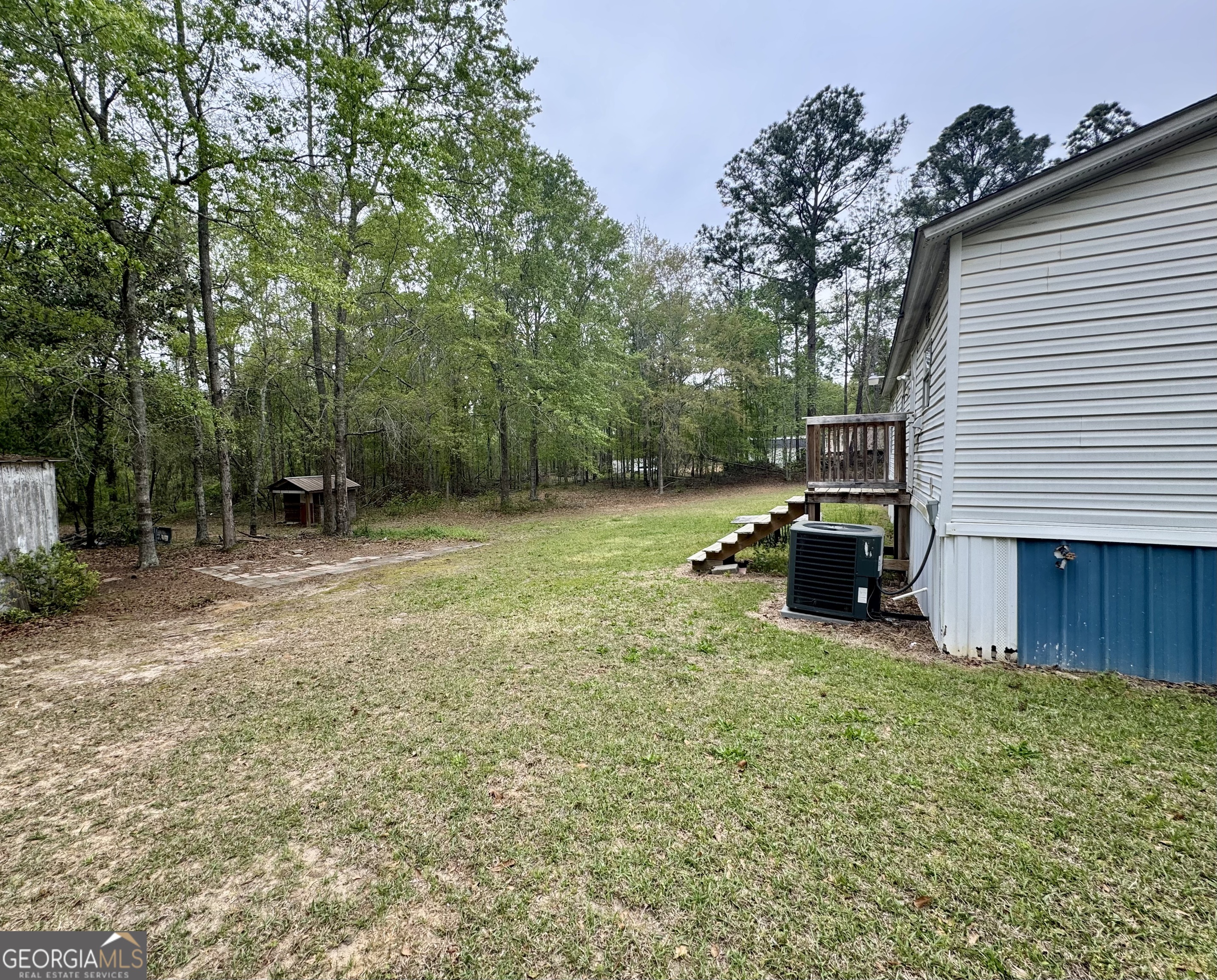 877 West Rushing Road Register, GA 30452 - Photo 6 of 18 a view of a backyard with sitting area