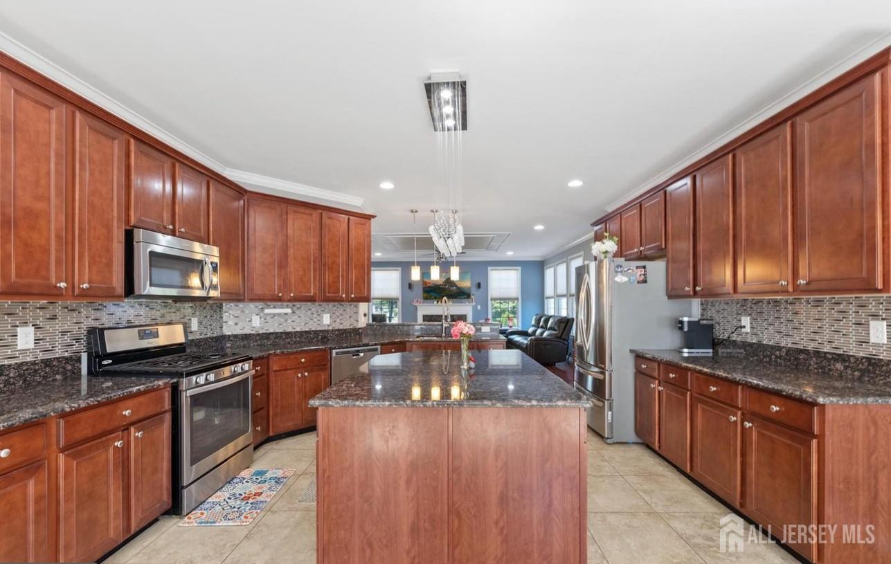 88 Bordentown Crosswicks Road Chesterfield, NJ 08515 - Photo 14 of 47 a kitchen with kitchen island granite countertop a sink stove and cabinets