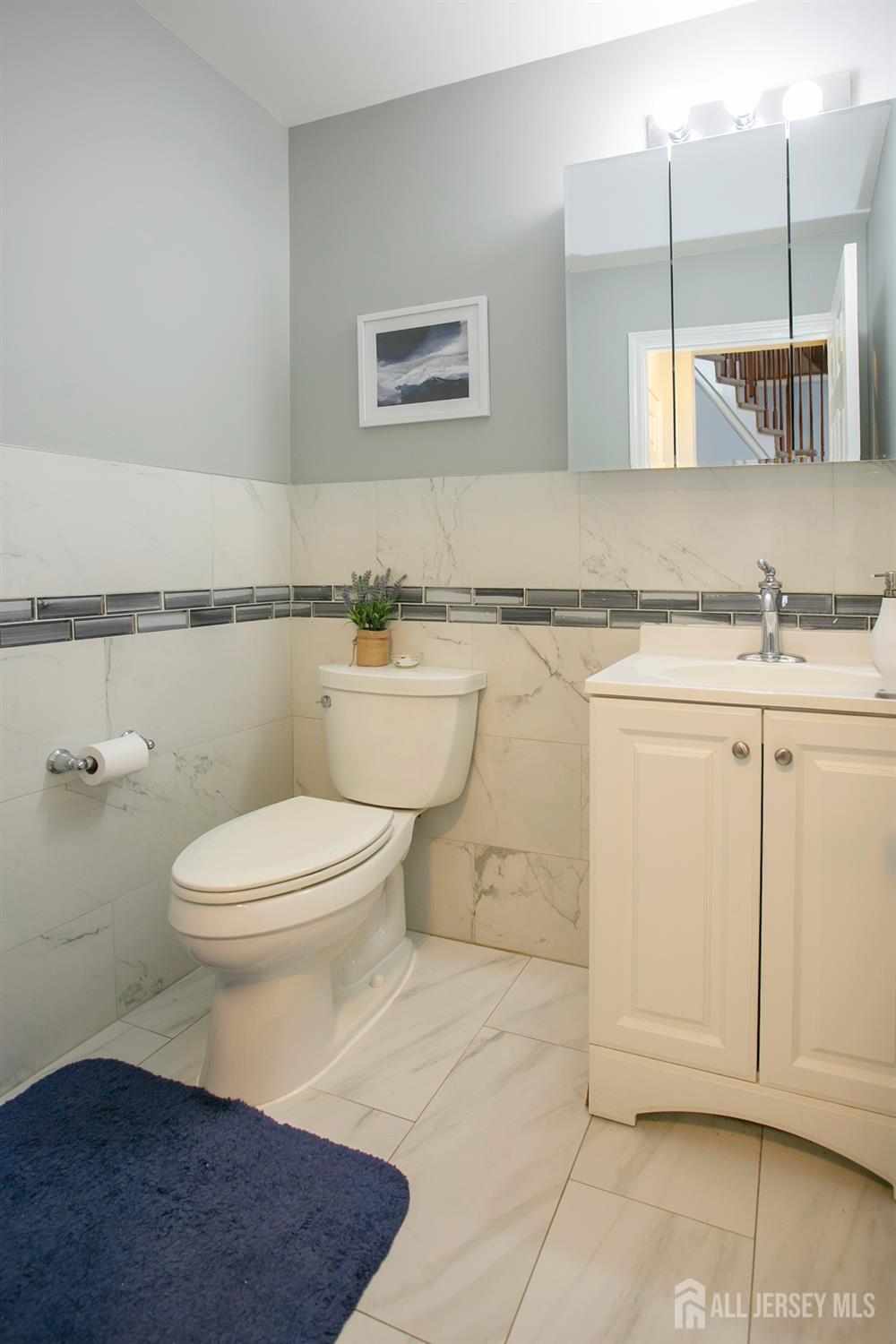 88 Bordentown Crosswicks Road Chesterfield, NJ 08515 - Photo 24 of 47 a bathroom with a granite countertop sink a toilet and mirror