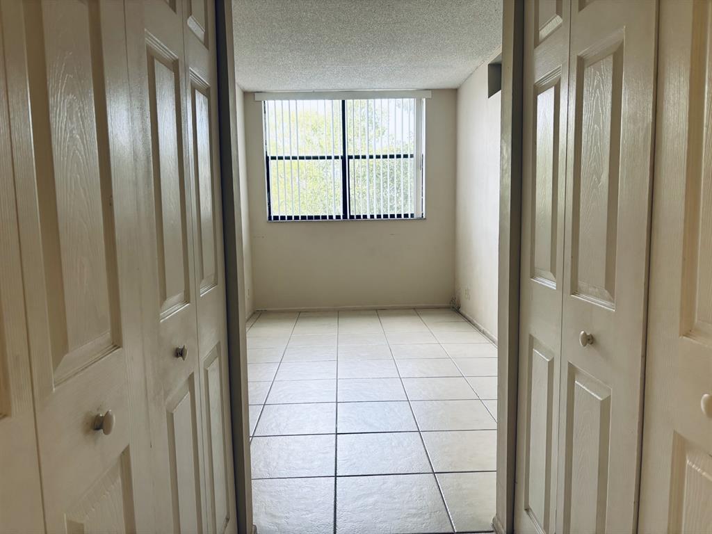 2401 Riverside Drive, Unit 311B Coral Springs, FL 33065 - Photo 11 of 12 a view of an empty room with a window