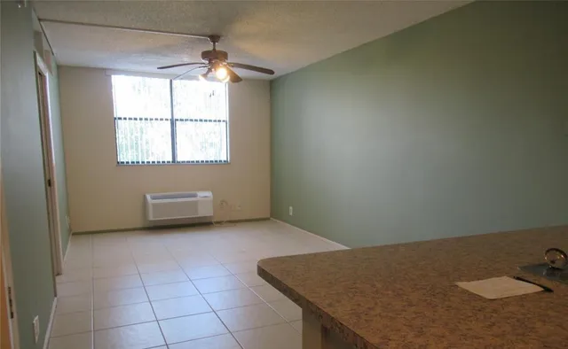 an empty room with a fireplace