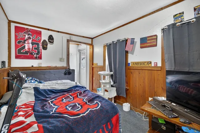 a view of walk in closet with clothes