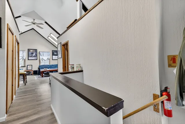 a living room with furniture and a dining table